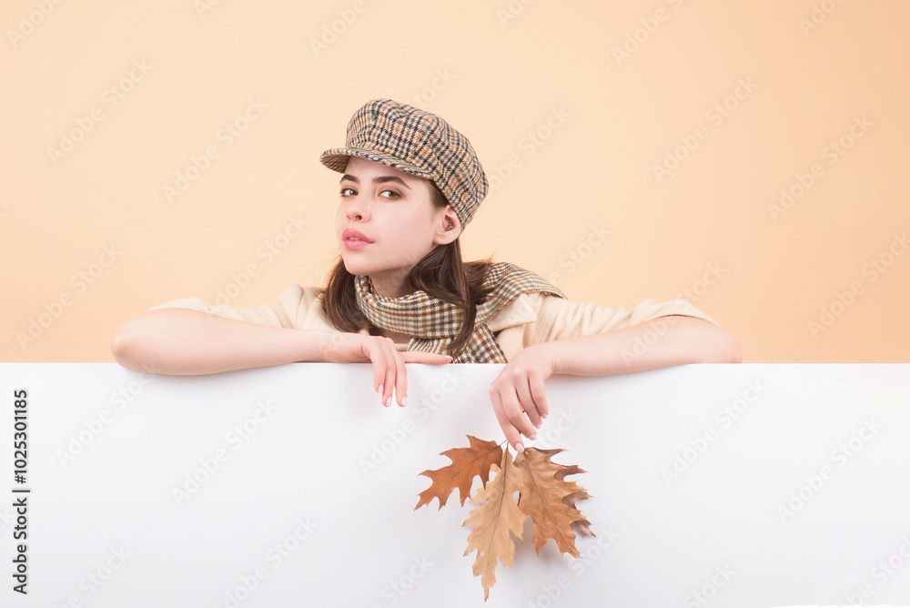 Studio isolated portrait of young happy woman with autumn fall leaves ...