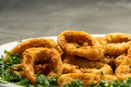 Presentation of a dish with fried prawns breaded with beer photo