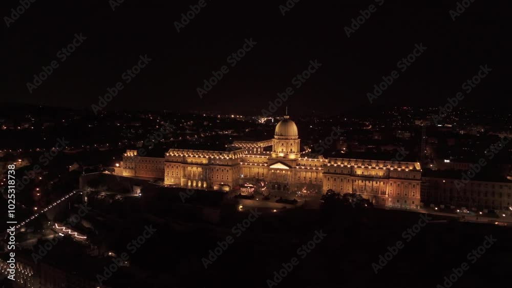 Top cinematic aerial view to the Budapest at night, aerial view of Danube river with evening illumination, Houses of Parliament in Budapest. High quality 4k Top cinematic aerial view to the Budapest at night, aerial view of Danube river with evening illumination, Houses of Parliament in Budapest. High quality 4k