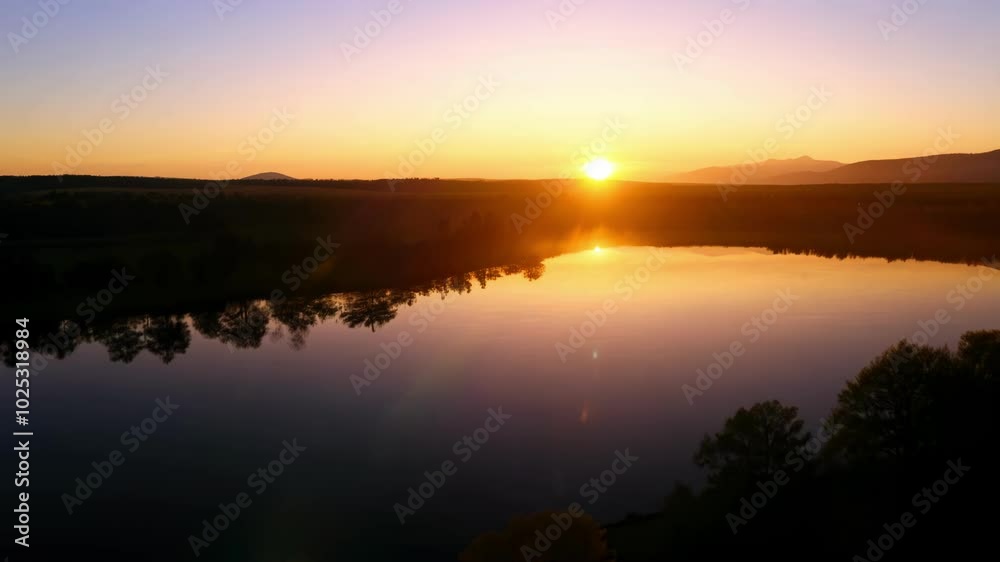 A serene sunrise over a calm lake, reflecting the peaceful beauty of nature. The tranquil scene captures the beginning of a new day in a soft, golden light. A serene sunrise over a calm lake, reflecting the peaceful beauty of nature. The tranquil scene captures the beginning of a new day in a soft, golden light.
