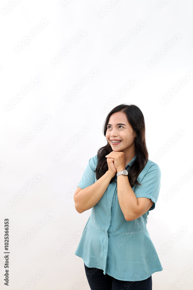 Cheerful thoughtful Asian female keeps hands under chin, hopes for something awesome, isolated on white background Cheerful thoughtful Asian female keeps hands under chin, hopes for something awesome, isolated on white background