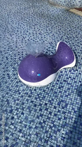 Fountain equipment in children's water park during summer holidays in the morning with bright blue sky background