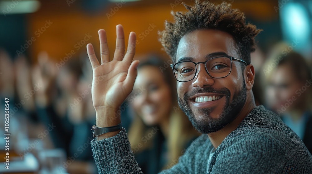 Smiling Man Waves in Classroom Setting Smiling Man Waves in Classroom Setting