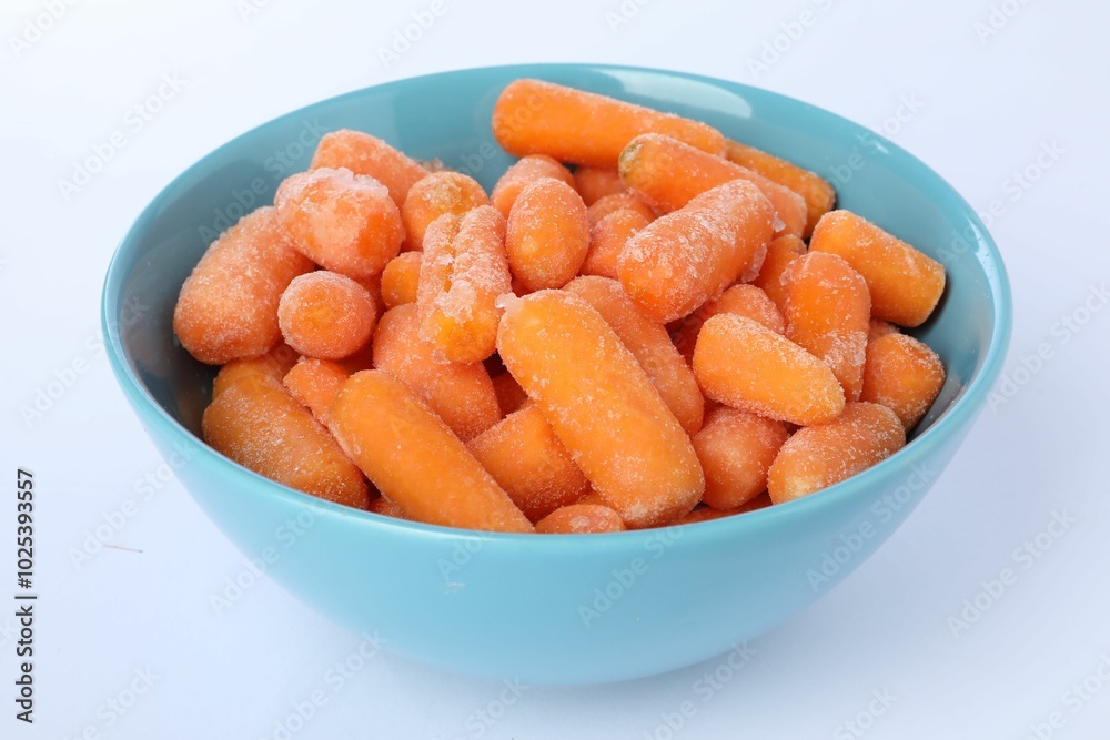 Frozen baby carrots in bowl isolated on white Frozen baby carrots in bowl isolated on white