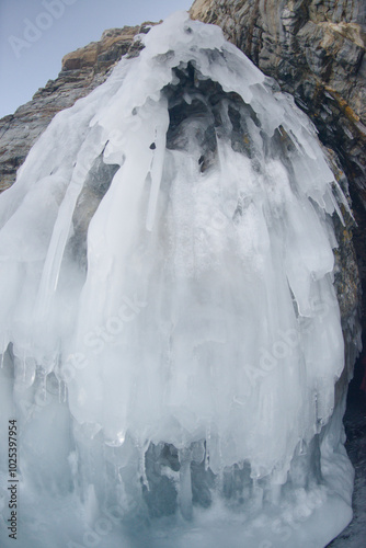 The freezing of the water in Lake Baikal has created ice caves in the rocks around Olkhon Island. This landscape only exists from mid-January to early April. Located at Irkutsk Oblast , Russia. photo