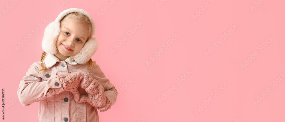 Little girl in stylish winter clothes showing heart shape with her hands on color background Little girl in stylish winter clothes showing heart shape with her hands on color background