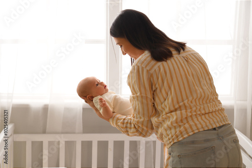 Young woman with her little...