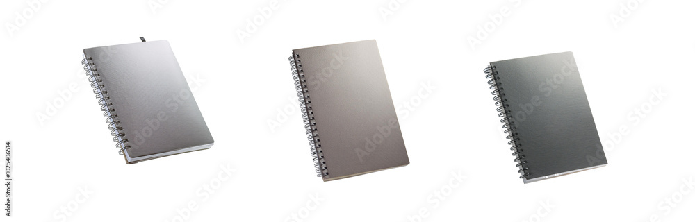 Three spiral bound notebooks with textured covers in different shades of gray. Three spiral bound notebooks with textured covers in different shades of gray.