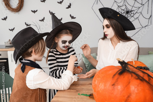 Happy family celebrating Halloween at home