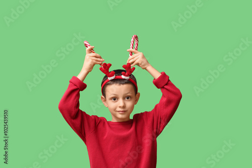 Funny little boy in reindee...