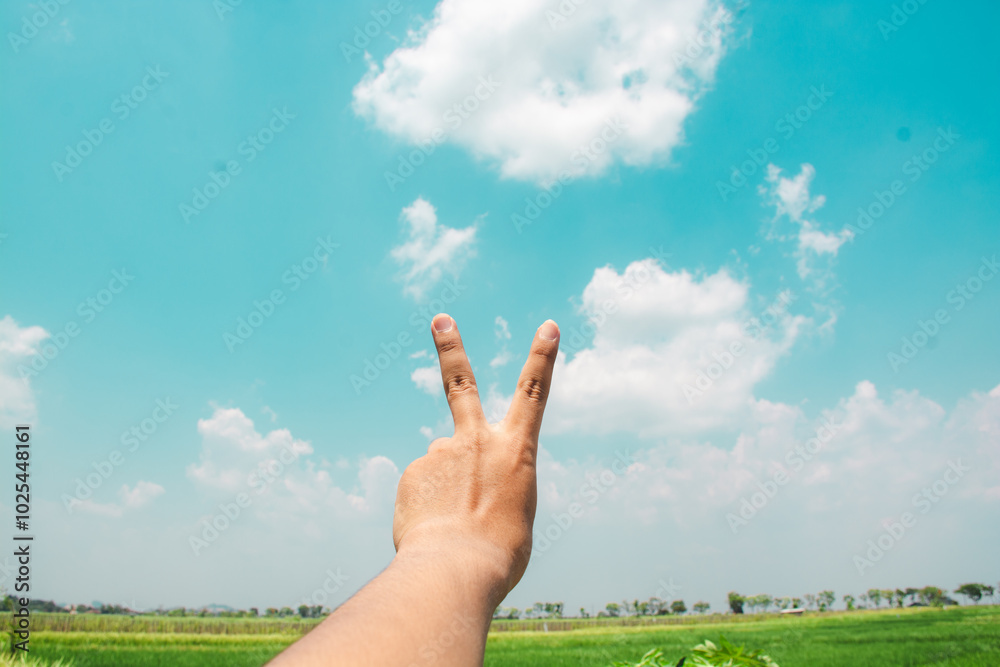hands reaching out to the sky in peace gesture hands reaching out to the sky in peace gesture
