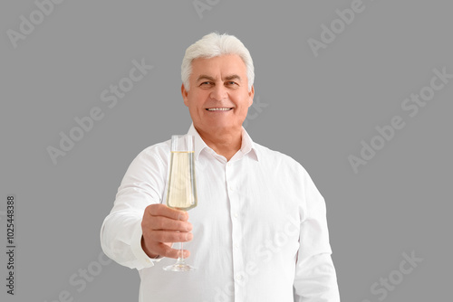 Senior man with glass of ch...
