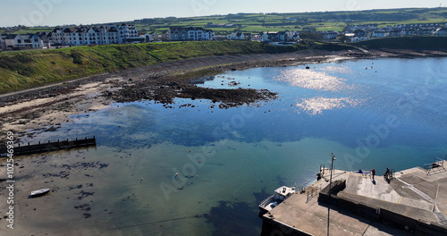 Aerial view of the beautiful Portballintrae Bay on the Co Antrim coast by the Atlantic Ocean Northern Ireland photo