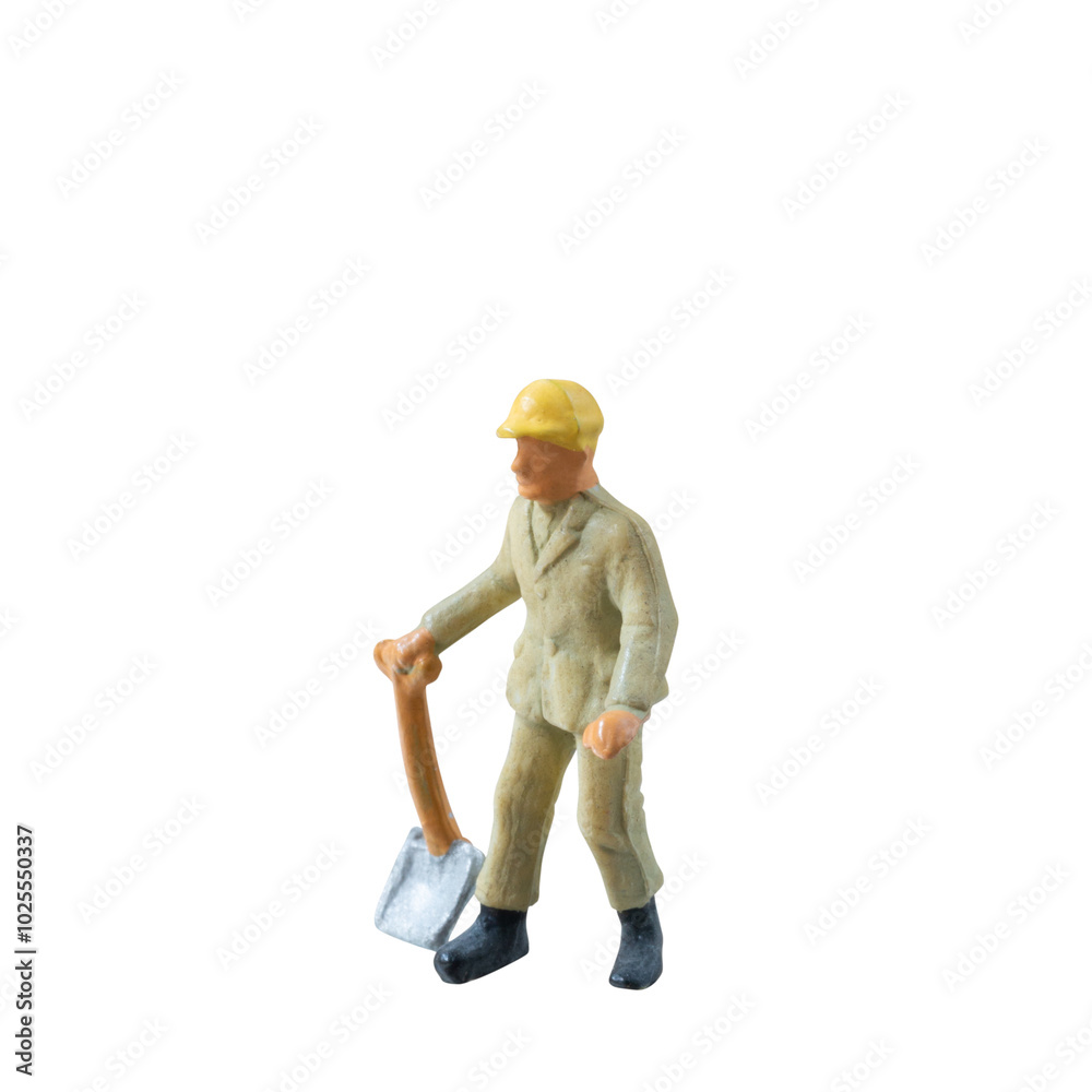 Miniature construction worker holding a shovel, isolate on white background with clipping path Miniature construction worker holding a shovel, isolate on white background with clipping path