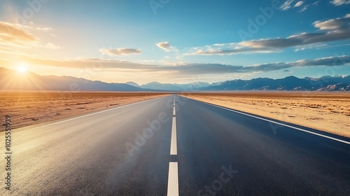 Empty Road Through Desert Landscape Under Sunset Sky