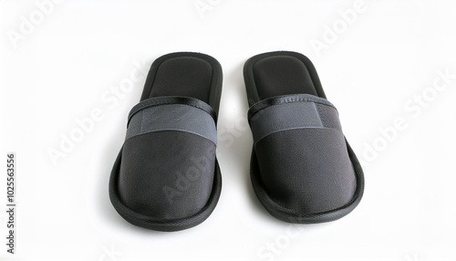 Cozy Comfort: A Pair of Sleek Black Slippers, perfect for relaxing evenings at home. Experience ultimate relaxation!