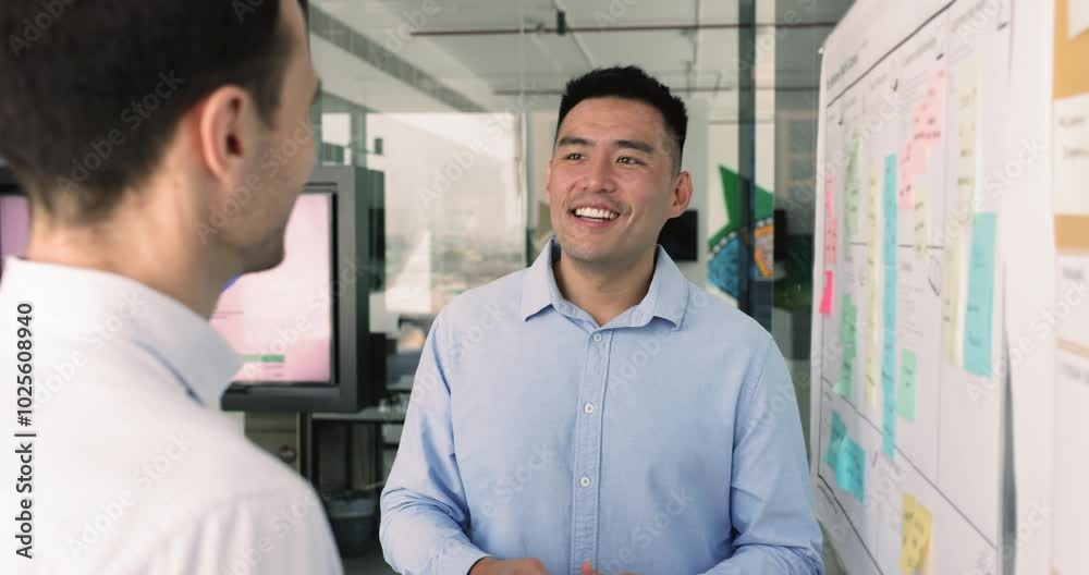Chinese man leads conversation to male colleague, explain tasks details, planning cooperation, working together on joint project, met in office for opinion and skills exchange. Teamwork, business talk