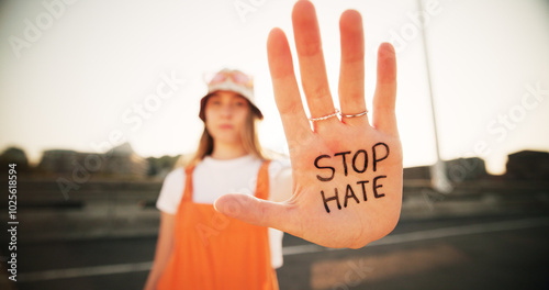 Obraz na plátně Hands, stop hate and equality for person with writing, sign and protest for racism, peace and inclusion