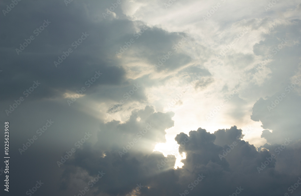It's a dark cloudy sky with sunlight shining through
It's a dark cloudy sky with sunlight shining through