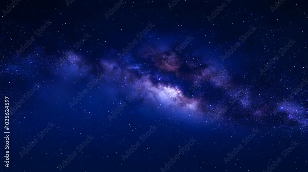 A Stunning View of the Milky Way Galaxy, with a Deep Blue Night Sky and Sparkling Stars A Stunning View of the Milky Way Galaxy, with a Deep Blue Night Sky and Sparkling Stars
