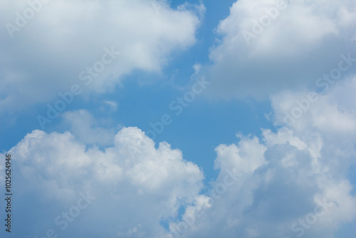  Blue sky and white puffy clouds