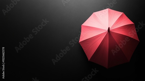 A red umbrella is on a black background