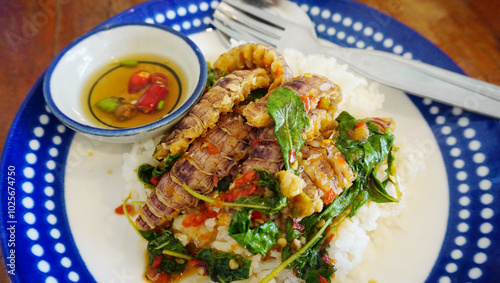 Stir-fried Mantis shrimp with basil top on rice, Seafood Thai style cuisine