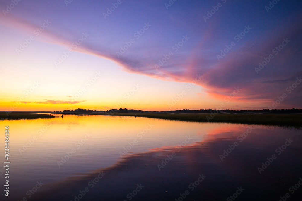 Sunset sky and horizon reflection on water Sunset sky and horizon reflection on water