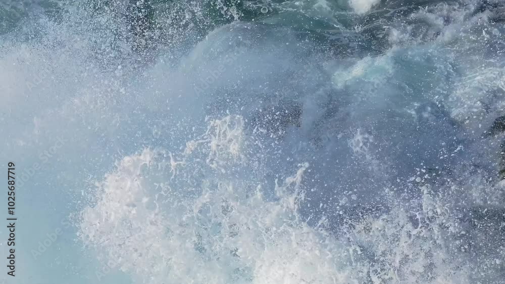 Foamy Rough Waves Crashing Onto Rocks. Close-up Shot Foamy Rough Waves Crashing Onto Rocks. Close-up Shot