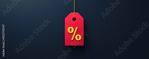 Red discount tag with percentage symbol hanging on string on dark background, ideal for sales promotions and retail marketing.