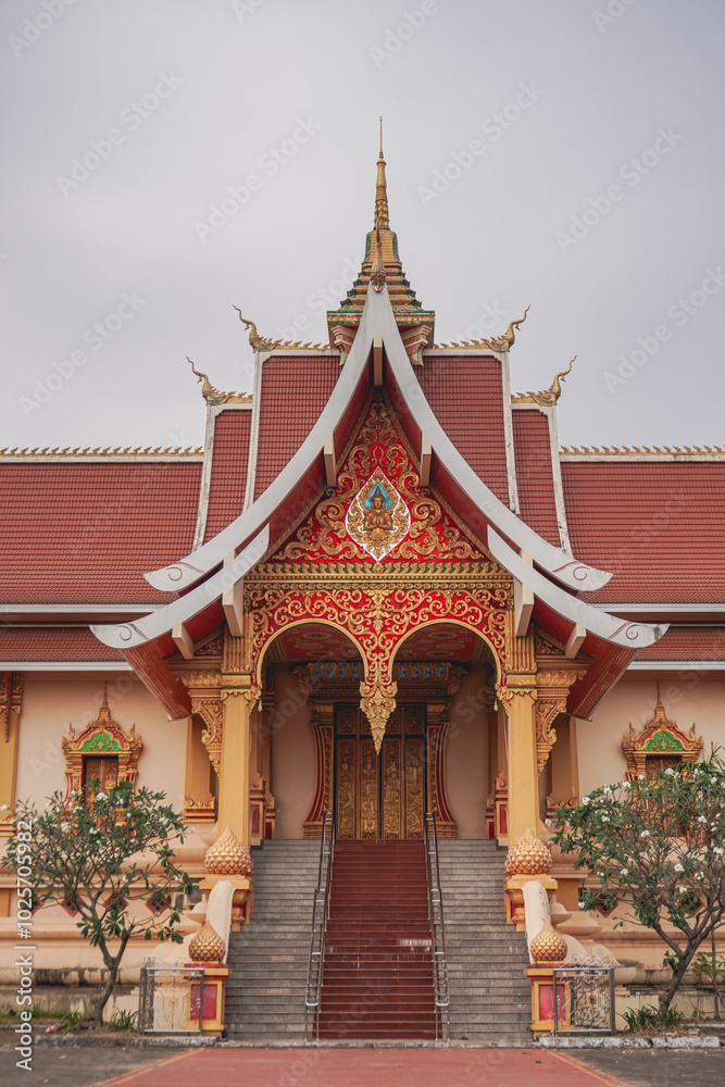 A beautiful gate entrance of temple palace that locate in the south of Wat Phra That Luang in Vientiane, Laos A beautiful gate entrance of temple palace that locate in the south of Wat Phra That Luang in Vientiane, Laos