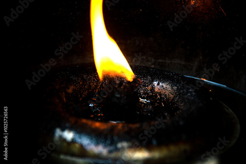 The flame in the oil lamp had black stains.