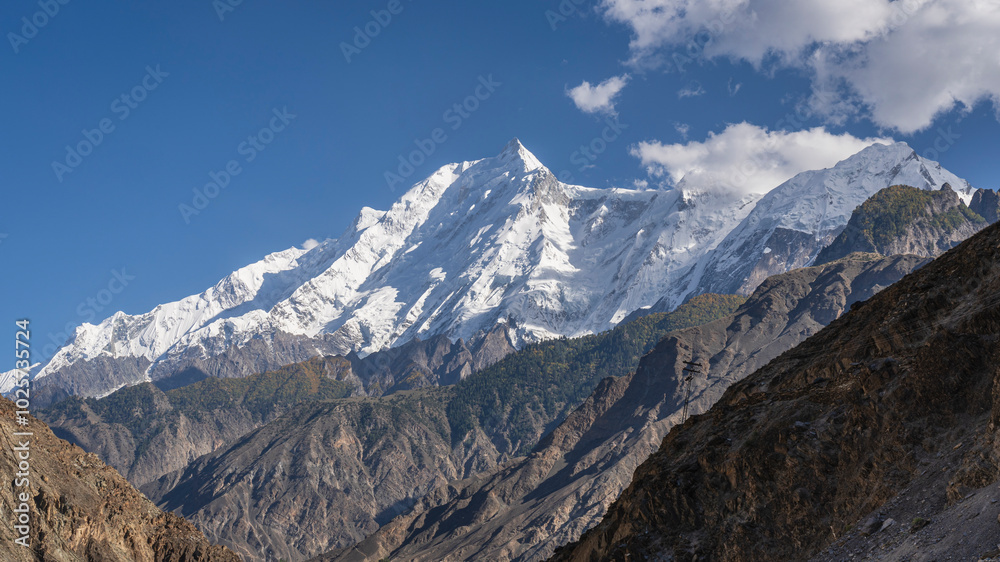 Summer landscape view on Rakaposhi mountain and summit from Karakoram Highway, Ghulmet, Nagar, Gilgit-Baltistan, Pakistan Summer landscape view on Rakaposhi mountain and summit from Karakoram Highway, Ghulmet, Nagar, Gilgit-Baltistan, Pakistan