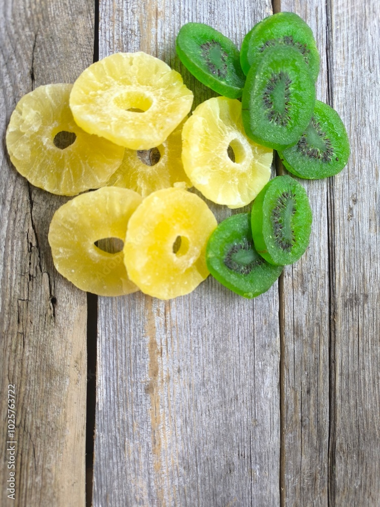 pineapple and kiwi slices on a wooden table. High quality photo pineapple and kiwi slices on a wooden table. High quality photo