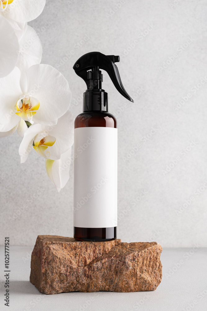 Brown cosmetic trigger sprayer bottle and white orchids Brown cosmetic trigger sprayer bottle and white orchids