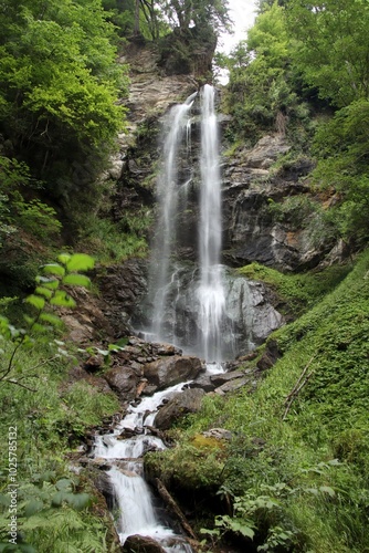 a high waterfall that is between rocks in Austria
