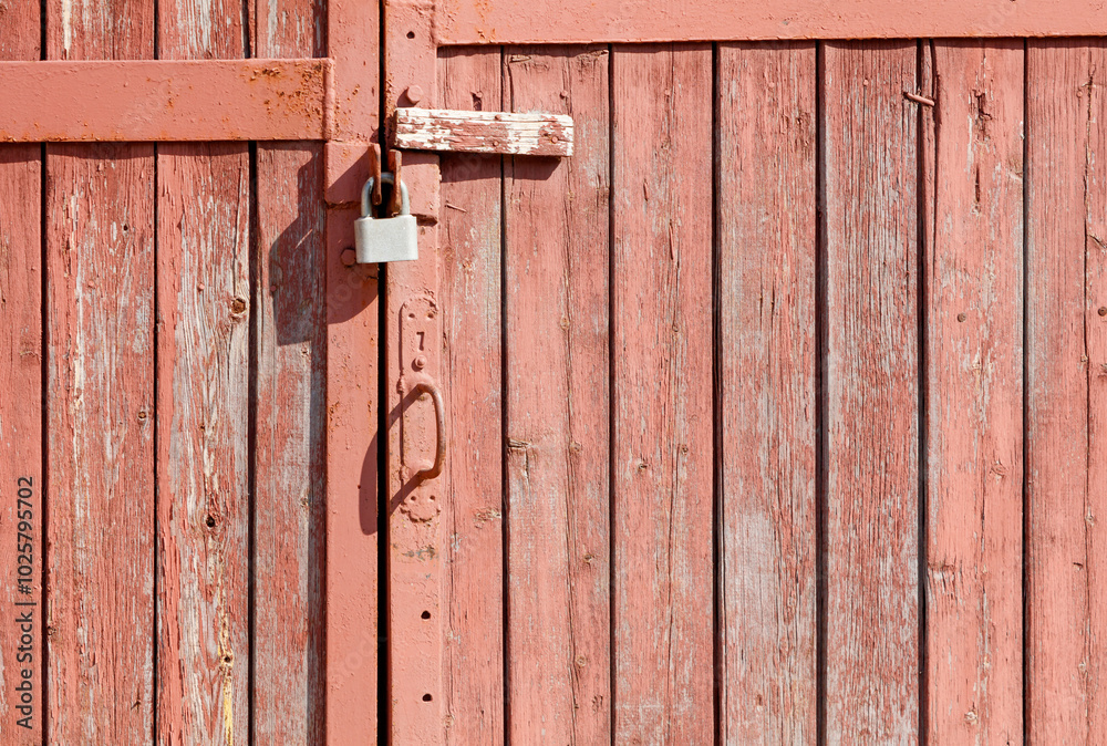 A rusty lock on a wooden door A rusty lock on a wooden door