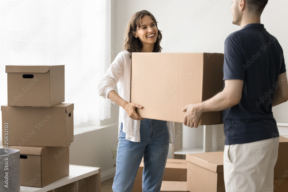 Be careful with fragile things. Happy young family couple diverse roommates friends engaged in relocation to new rented house flat apartment work together carry stuff stack boxes in empty living room Be careful with fragile things. Happy young family couple diverse roommates friends engaged in relocation to new rented house flat apartment work together carry stuff stack boxes in empty living room