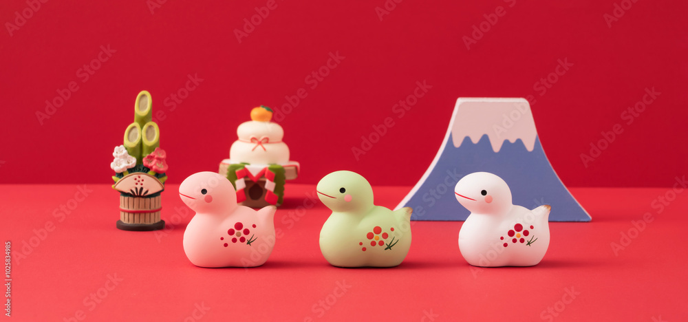 Japanese new year. Zodiac Snake. Snake ornaments and Mt.Fuji and kadomatsu on the red background. 日本のお正月。干支の巳(ヘビ)。赤背景上の巳の置物と富士山と門松。 Japanese new year. Zodiac Snake. Snake ornaments and Mt.Fuji and kadomatsu on the red background. 日本のお正月。干支の巳(ヘビ)。赤背景上の巳の置物と富士山と門松。
