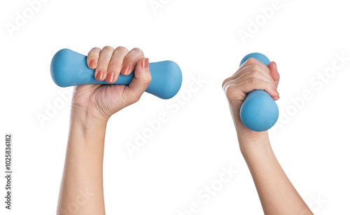 Female hands holding blue dumbbell isolated on white background photo