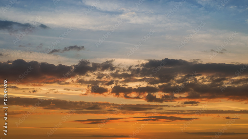 Summer evening sky in the picturesque clouds, lit by the rays of the setting sun. Summer evening sky in the picturesque clouds, lit by the rays of the setting sun.