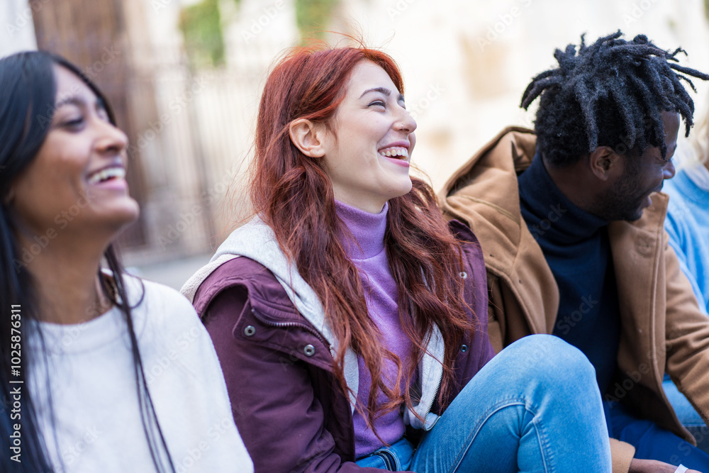 Diverse students laughing outdoors, multicultural friends enjoying cheerful moment on campus Diverse students laughing outdoors, multicultural friends enjoying cheerful moment on campus
