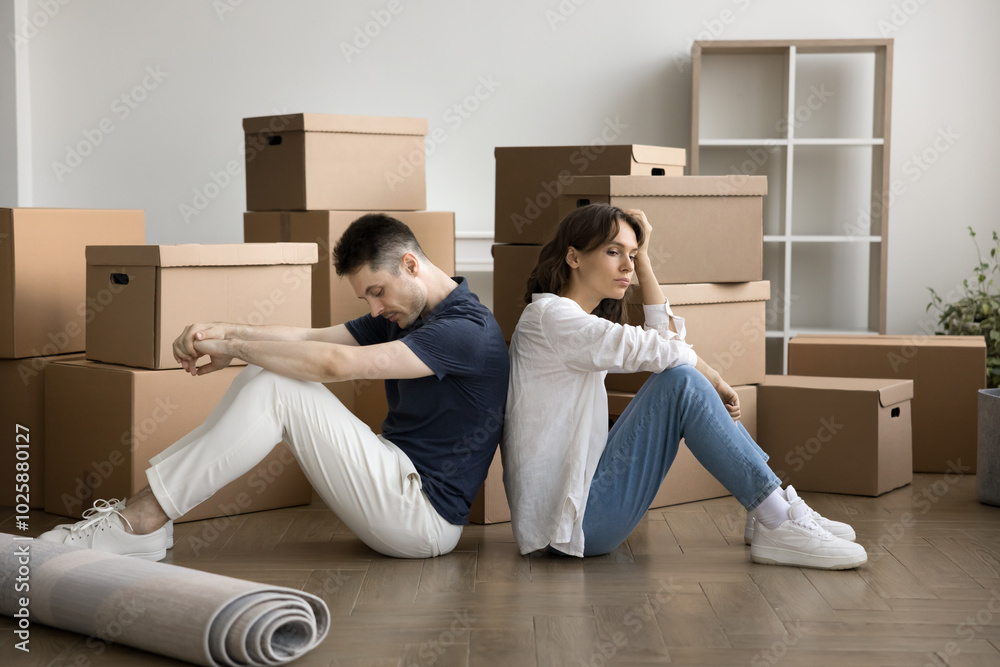 © fizkes - Relocation is hard work. Fatigued exhausted young family couple first time home buyers sit on floor back to back take break rest from carrying boxes unpacking belongings feel too tired at moving day © fizkes - Relocation is hard work. Fatigued exhausted young family couple first time home buyers sit on floor back to back take break rest from carrying boxes unpacking belongings feel too tired at moving day