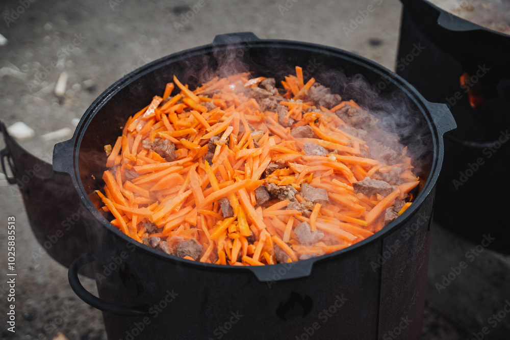 On the stove, a pot gently simmers with a hearty blend of fresh carrots and tender meat, resulting in a delightful dish that is bound to please anyones palate and taste buds On the stove, a pot gently simmers with a hearty blend of fresh carrots and tender meat, resulting in a delightful dish that is bound to please anyones palate and taste buds