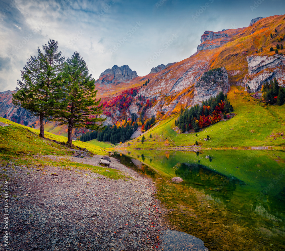 Astonishing autumn scene of Swiss Alps with Santis peak reflected in calm waters of Seealpsee lake. Exciting outdoor scene of Switzerland countryside. Beauty of nature concept background. Astonishing autumn scene of Swiss Alps with Santis peak reflected in calm waters of Seealpsee lake. Exciting outdoor scene of Switzerland countryside. Beauty of nature concept background.
