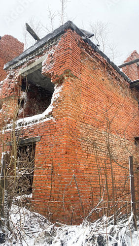 unfinished red brick house, snow