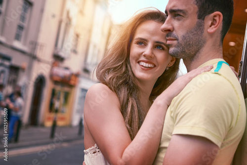 Travel, man and woman with hug, smile and urban journey on holiday, adventure or honeymoon. Vacation, love and happy couple with romance in city for Europe, street tourism and sightseeing together