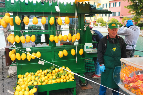 A Man Selling Big Fresh Italian Lemons In Sirmione, Italy