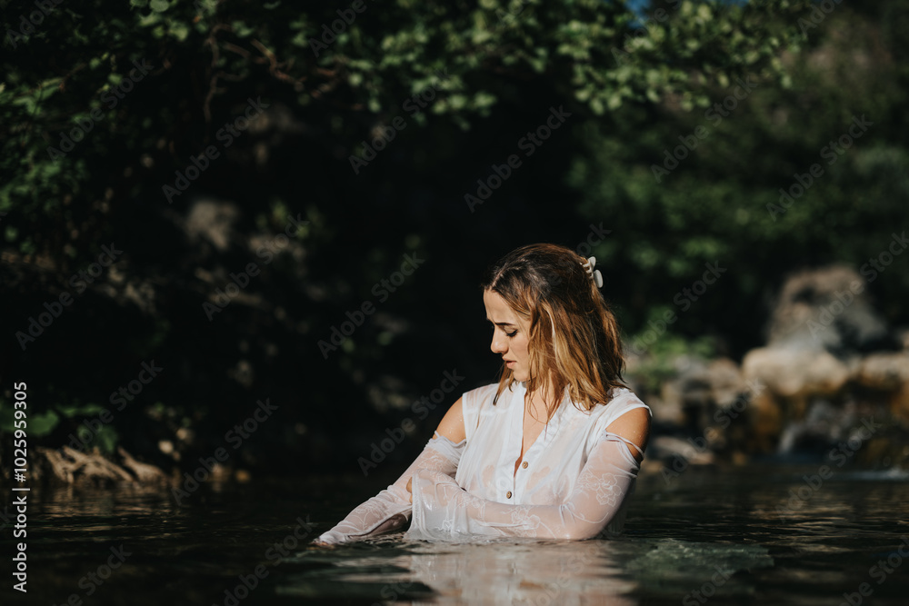 A woman in a white dress standing gracefully in a peaceful forest stream, surrounded by lush greenery and natural beauty. A woman in a white dress standing gracefully in a peaceful forest stream, surrounded by lush greenery and natural beauty.