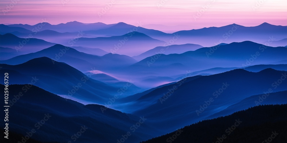 Misty Mountain Range at Dawn with Blue and Purple Layers Fading into Distance Misty Mountain Range at Dawn with Blue and Purple Layers Fading into Distance